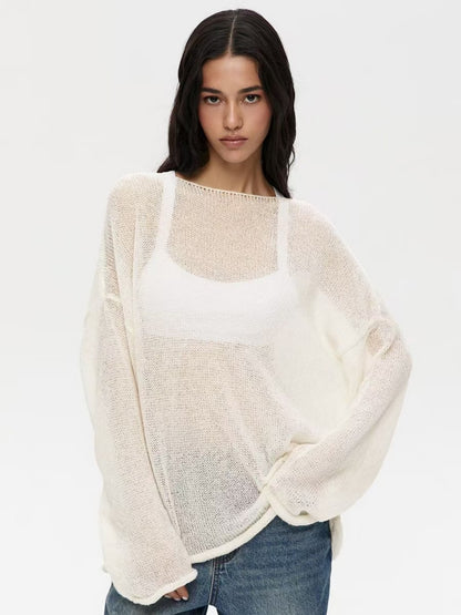 Woman modeling white sheer sweater with bell sleeves, front view