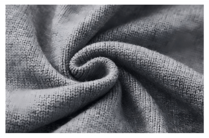 Close-up showing the knit fabric texture of the sleeveless sweater.