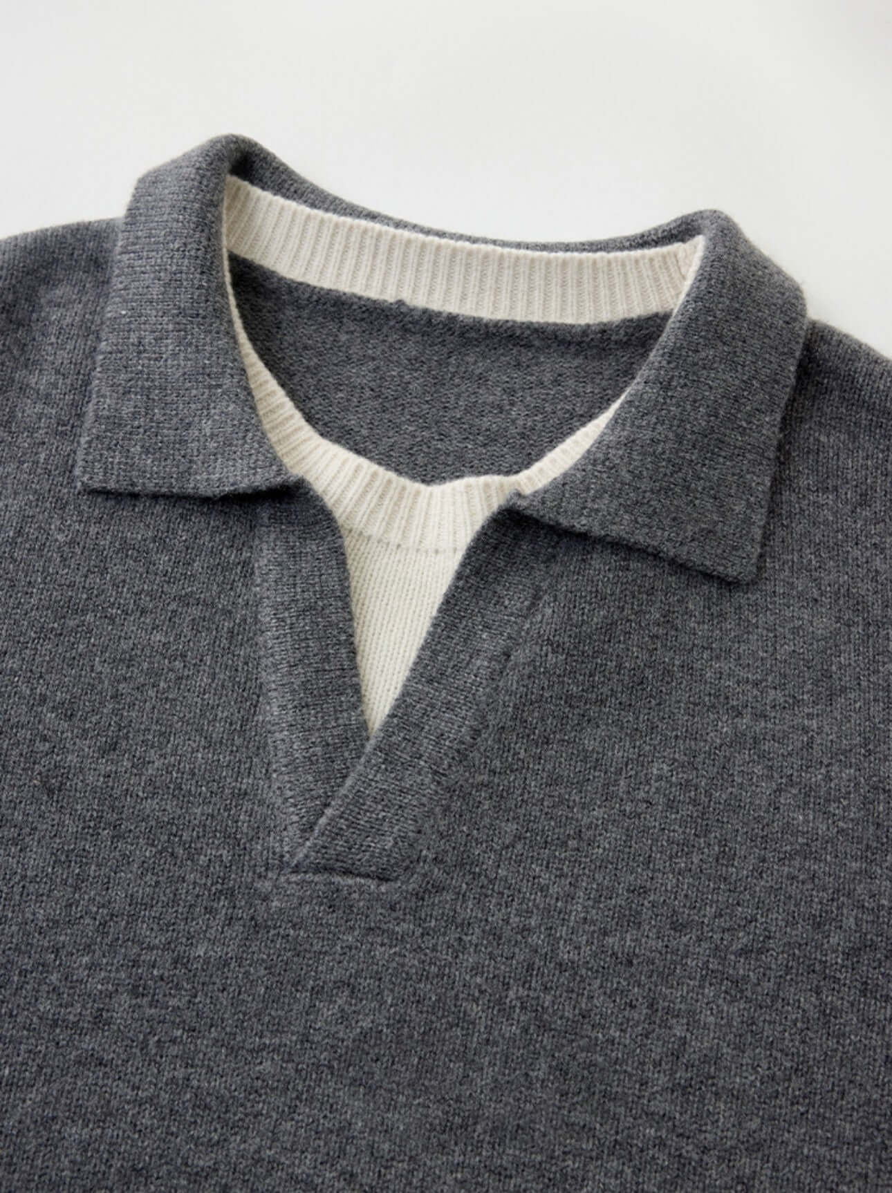 Unisex Cashmere Sweater OEM - Mock Neck and V-Neck, stylish gray knitwear piece with contrasting collar.
