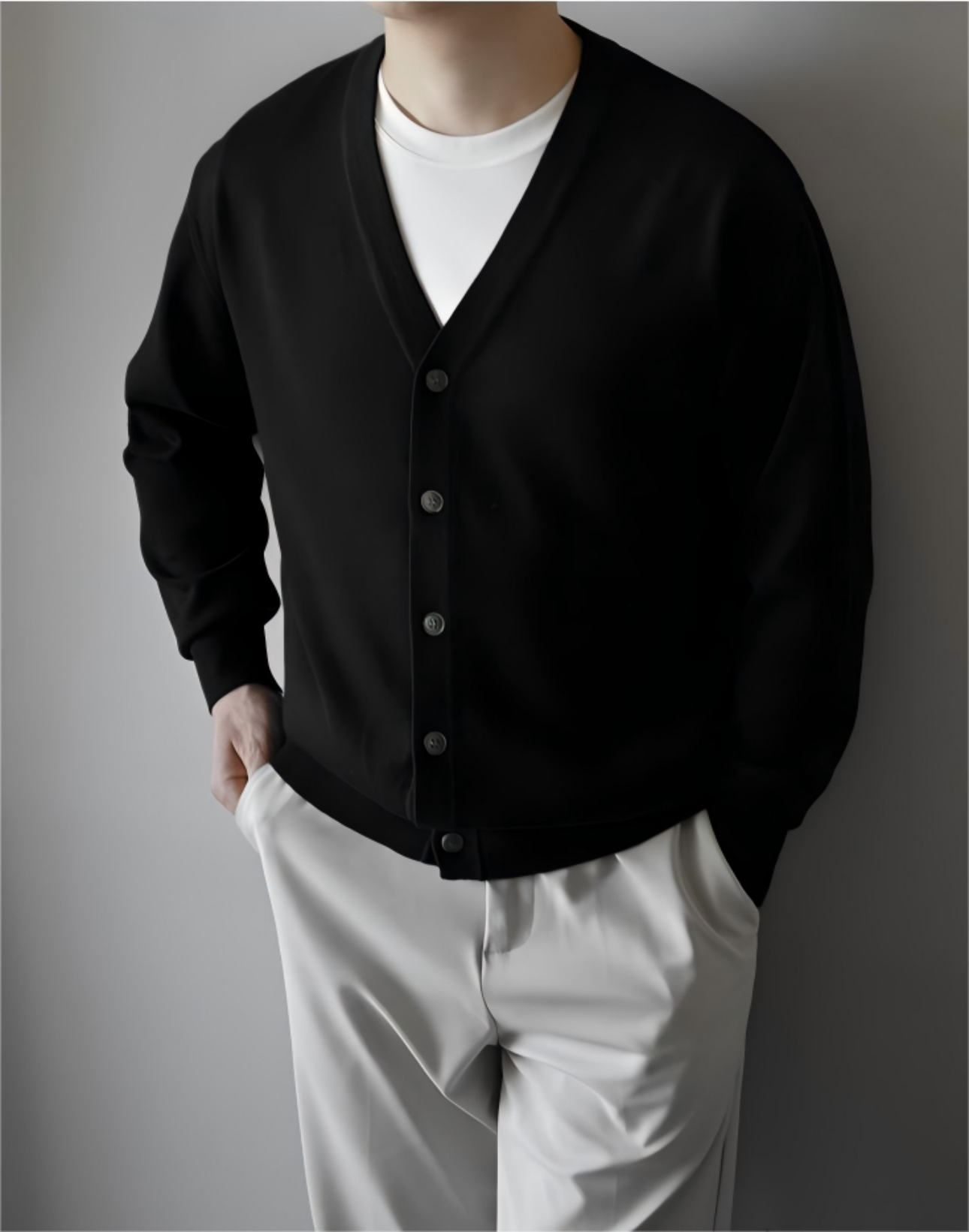 Model wearing black wool cardigan, front view