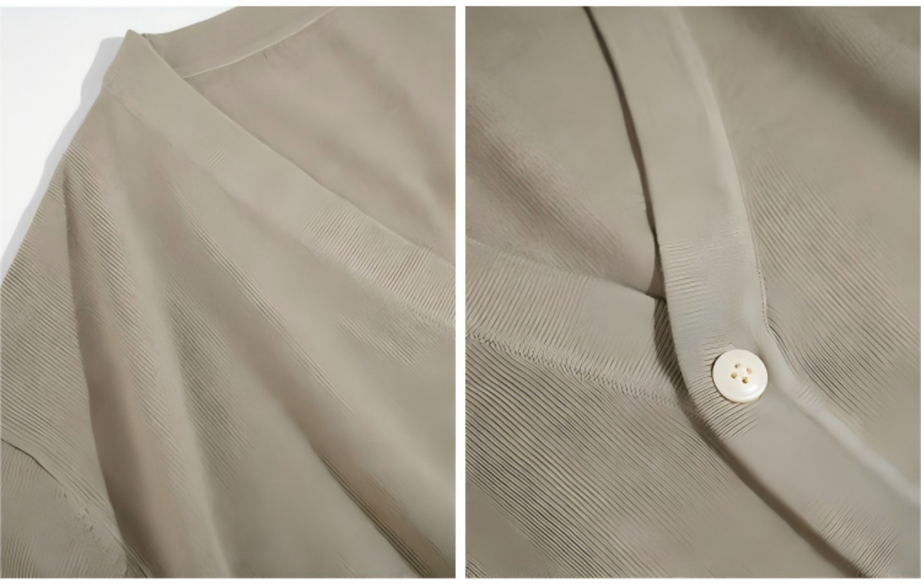 Lay flat detail shot of V-neck and placket on wool cardigan