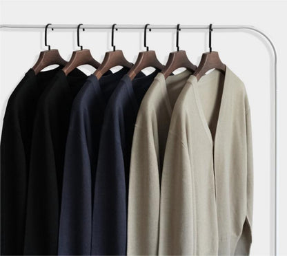 Apricot and black color options of wool cardigan on hanger for wholesale